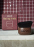 A NAVVE Blurring Brush with a brown handle and black bristles