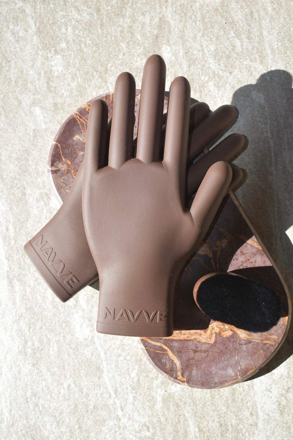 A pair of NAVVE silicone Glaze Gloves displayed